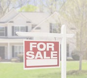 Image of a house with a for sale sign